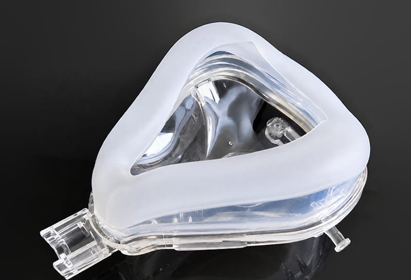 Respirator mask with LSR overmolded seal