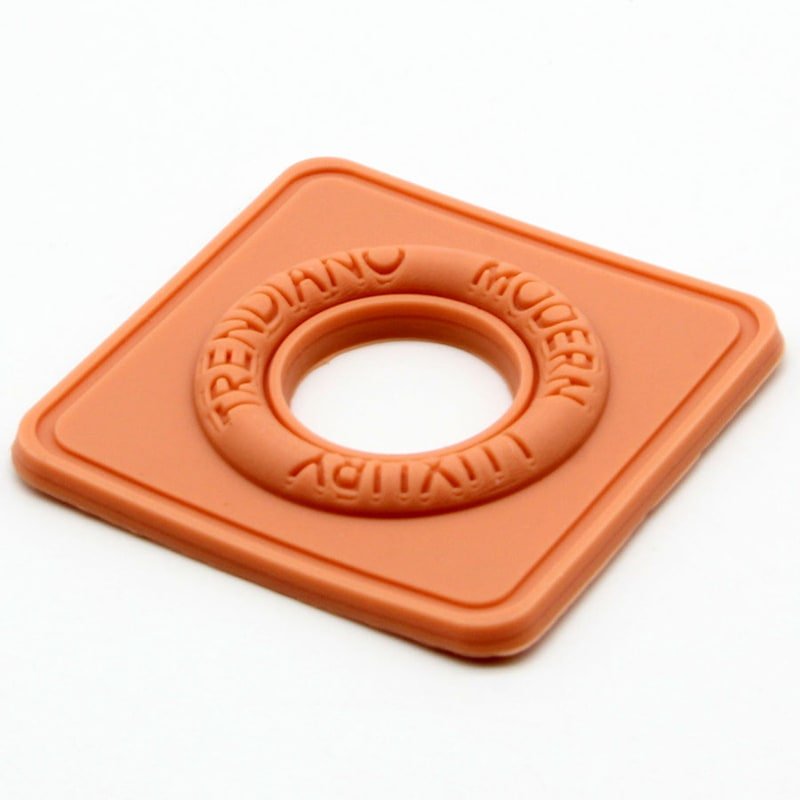 Debossed silicone label sample with recessed molded detail