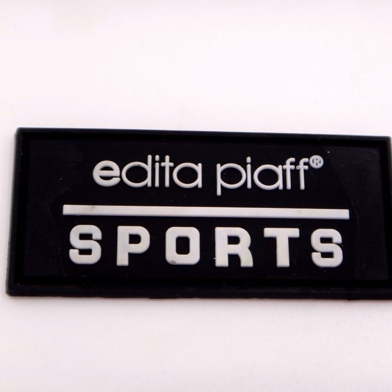 Drip silicone sports label sample with glossy raised lettering