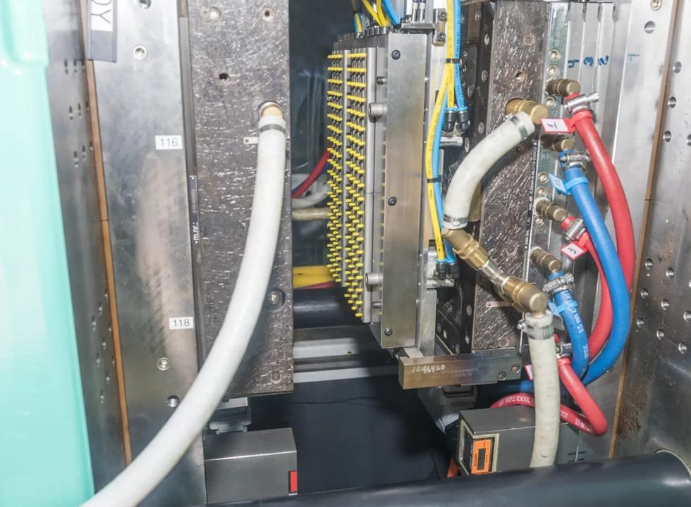 Silicone molding machine and tooling setup