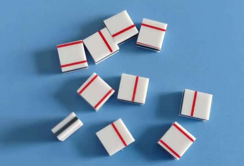 White silicone rubber zebra connector samples with red guide stripes